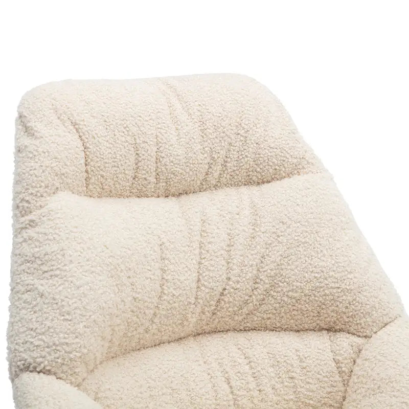 Fauteuil à bascule capitonné en tissu bouclé