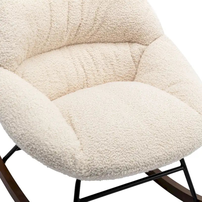 Fauteuil à bascule capitonné en tissu bouclé