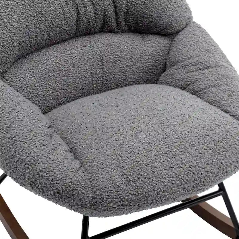 Fauteuil à bascule capitonné en tissu bouclé